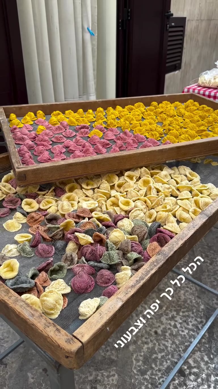 Handmade colorful orecchiette drying in the street