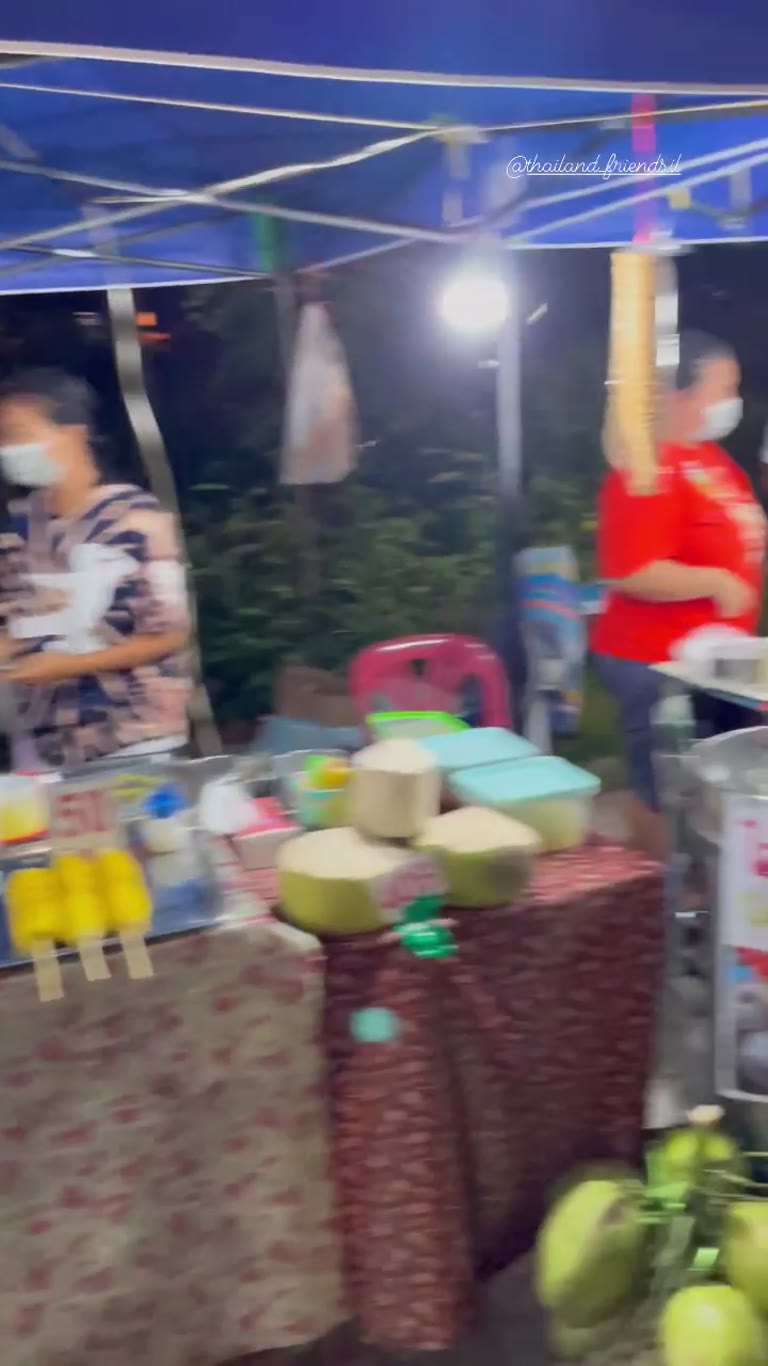 Thai night market food stalls with kids