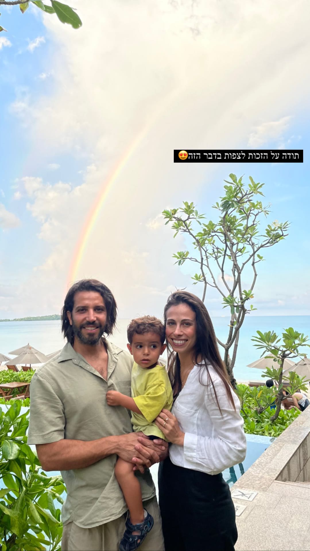 Family rainbow moment at a Thai beach resort