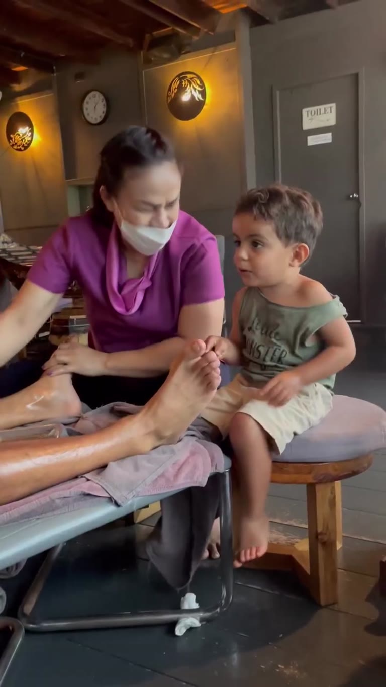Foot massage in Thailand with a toddler in tow