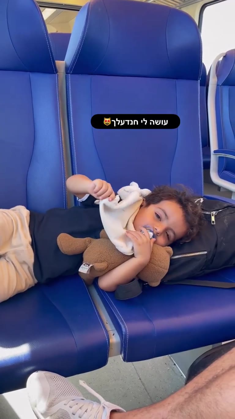 Toddler napping on the train in Amsterdam