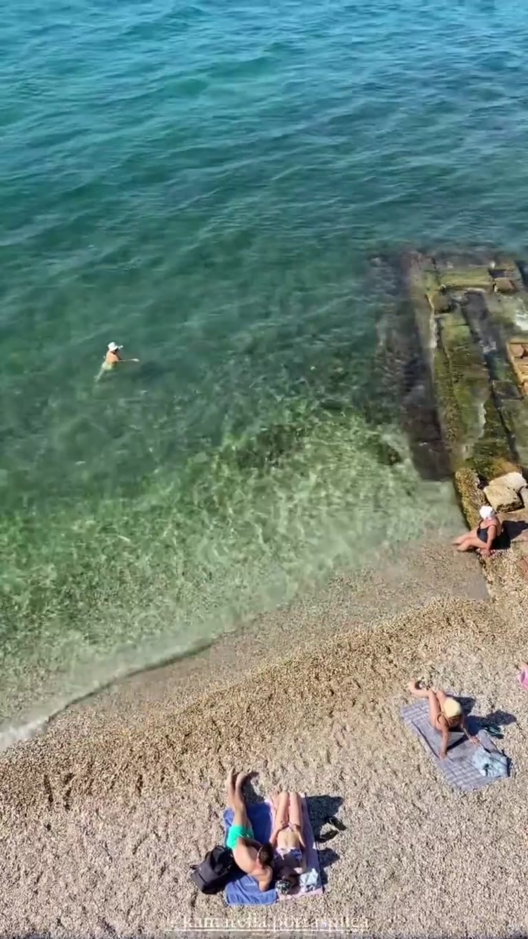 Kamarella beach in Corfu with MSC ship passing