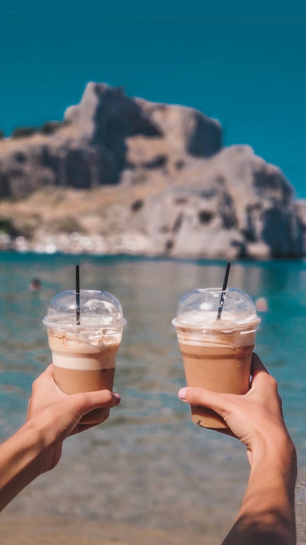 Freddo coffees on a Rhodes beach
