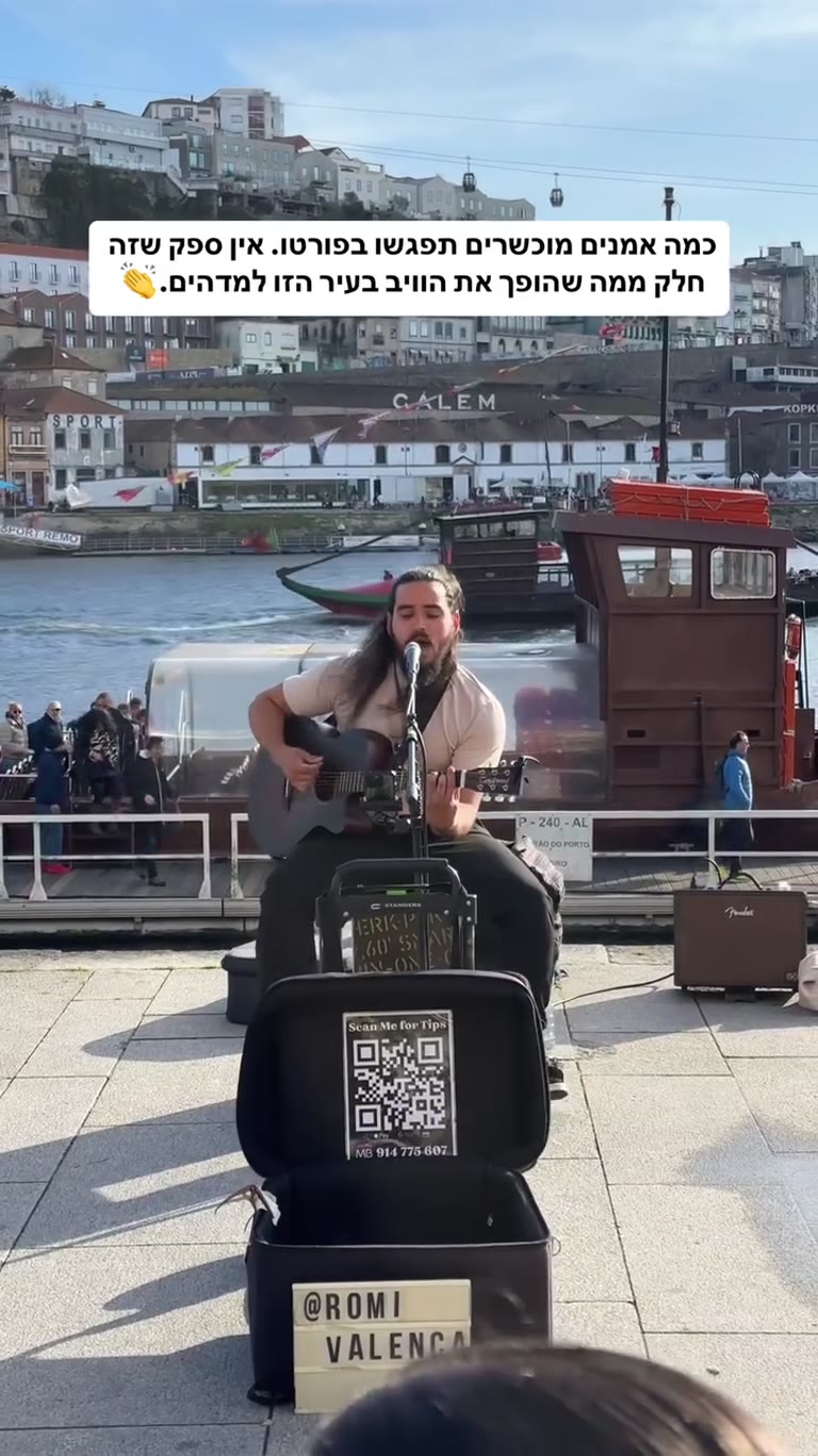 Street musician on Porto's Douro riverfront