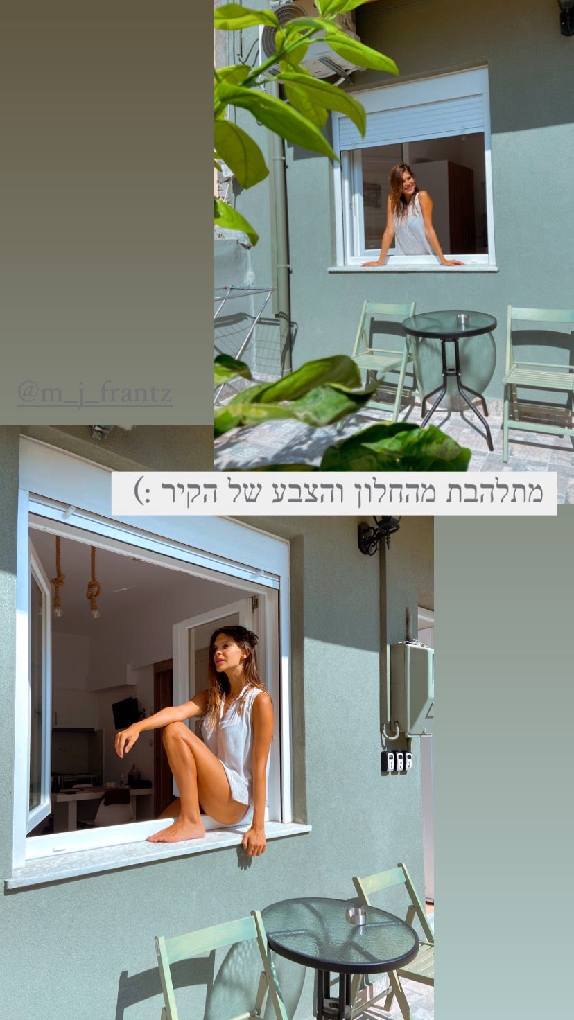 Mint-green apartment window in Crete