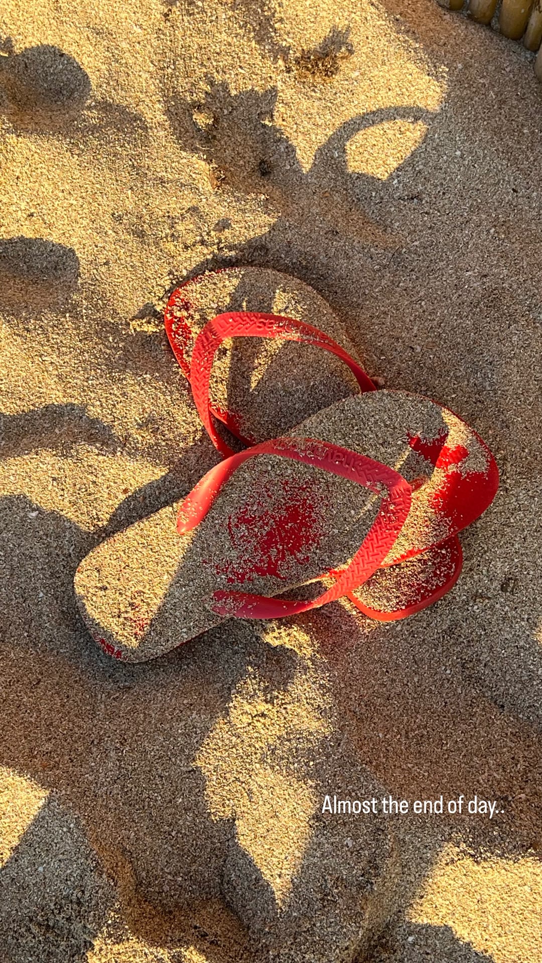 Sandy flip-flops at the end of a beach day