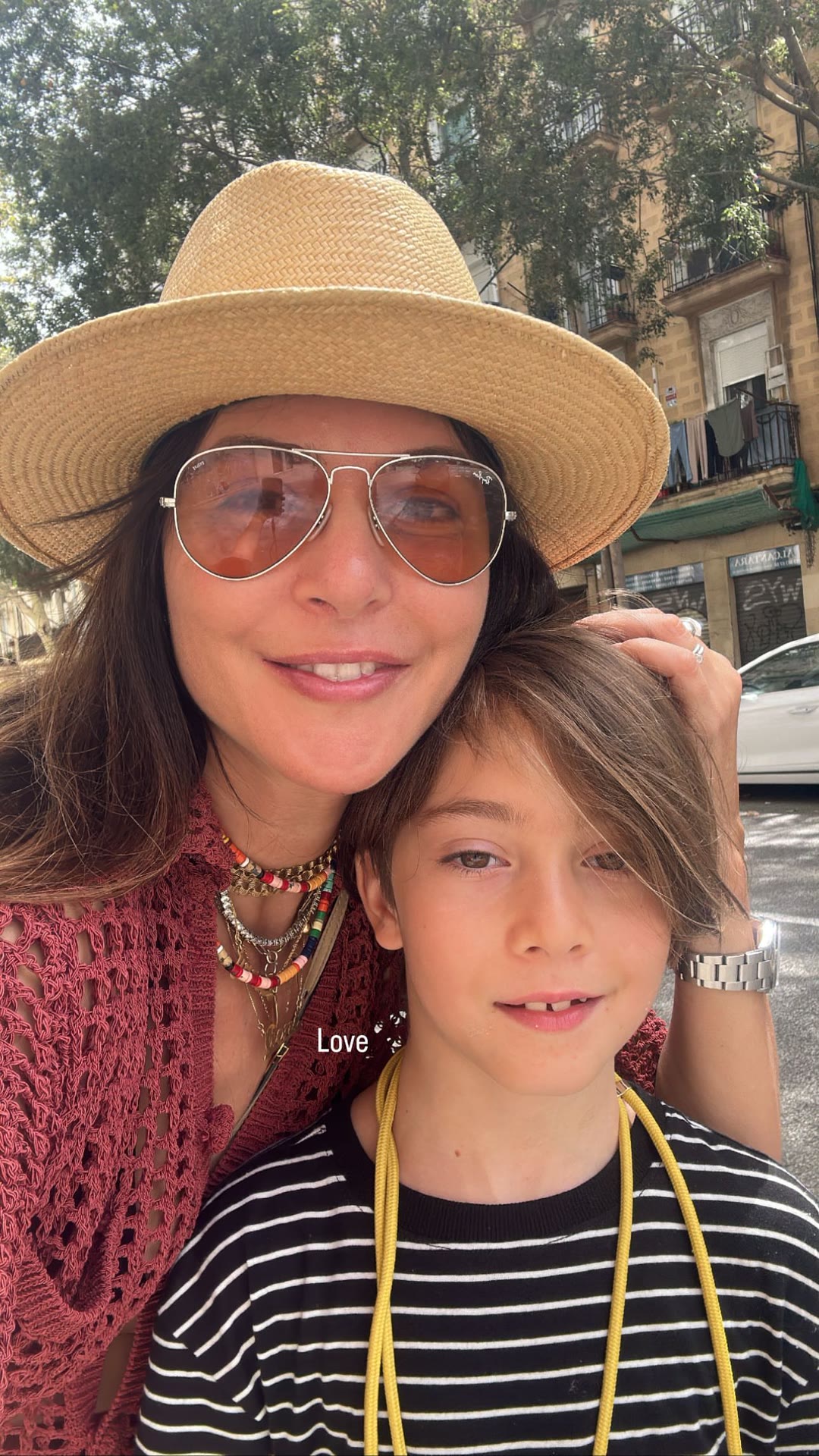 Mother-and-son selfie on a Spanish street