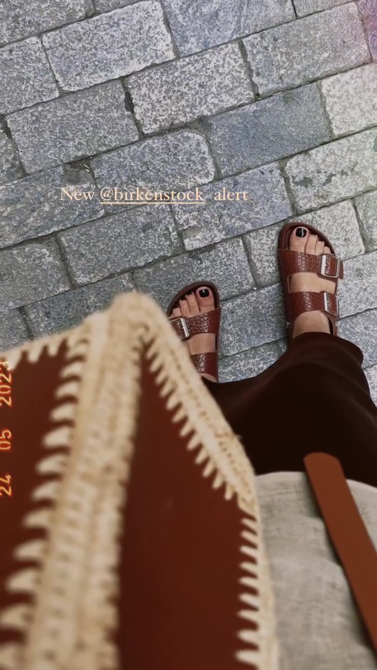 New brown Birkenstocks on Athens cobblestones