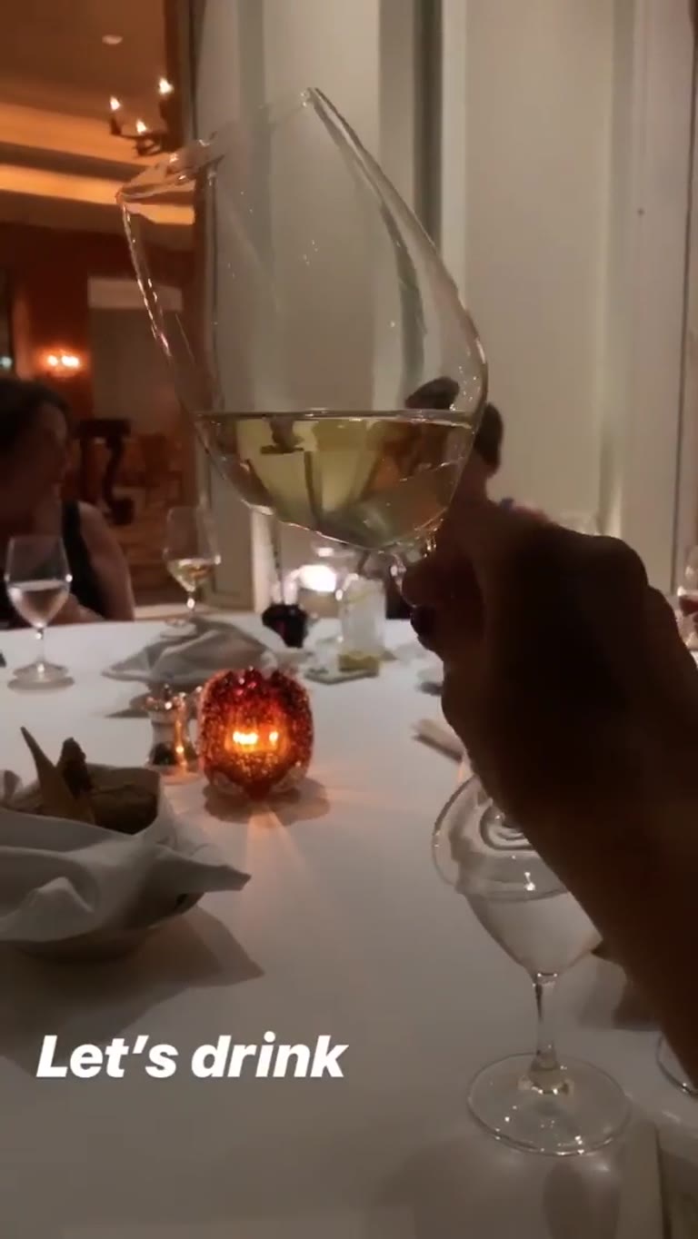 White wine toast at dinner in Cyprus