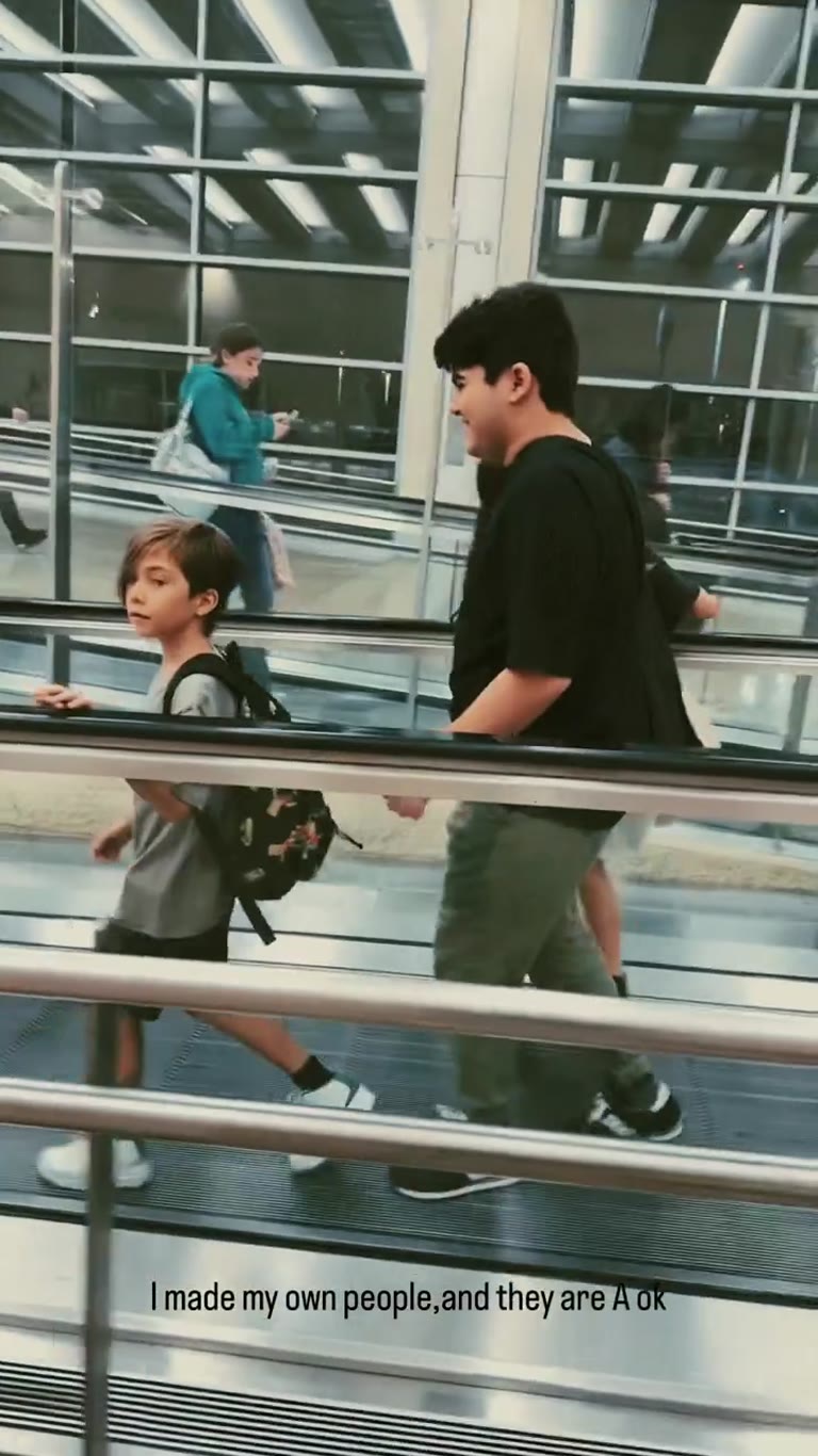 Airport travelator with the kids, Spain trip