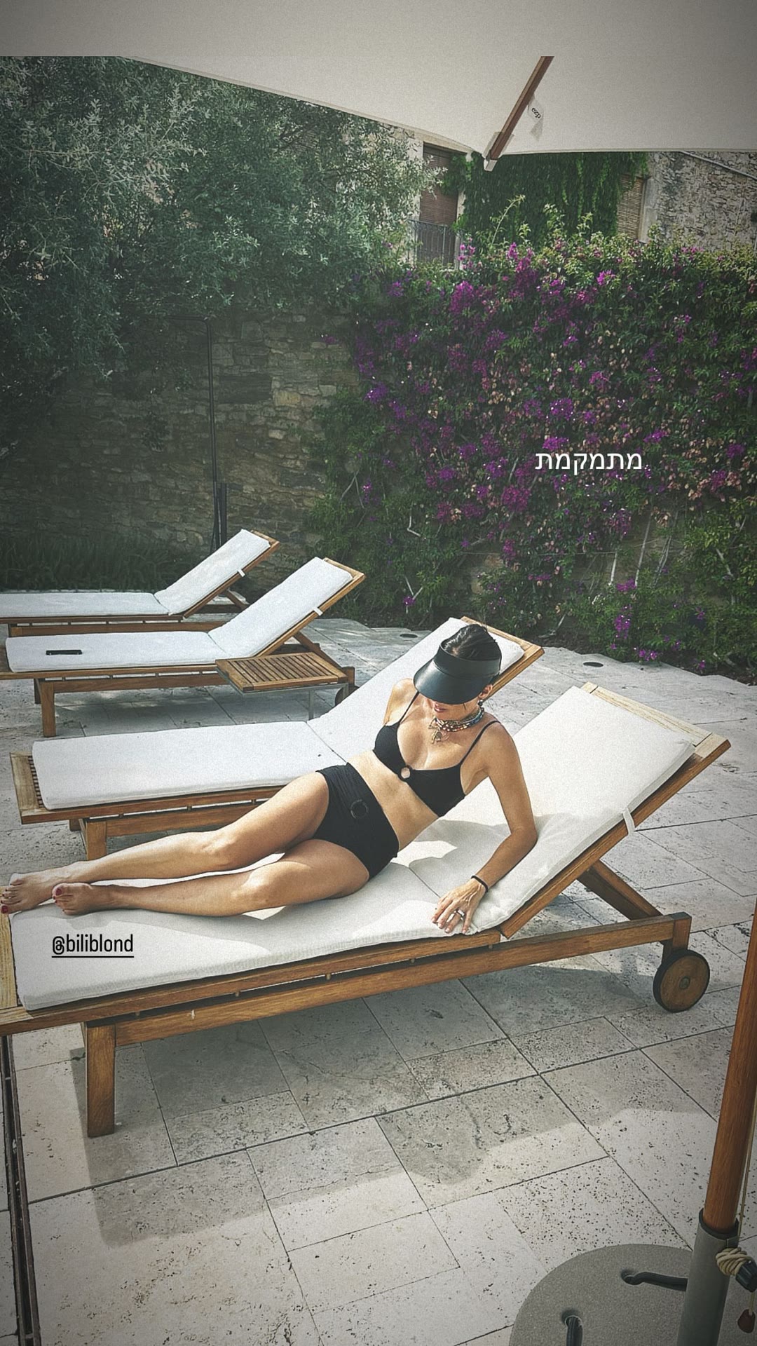 Poolside sunbathing in Spain
