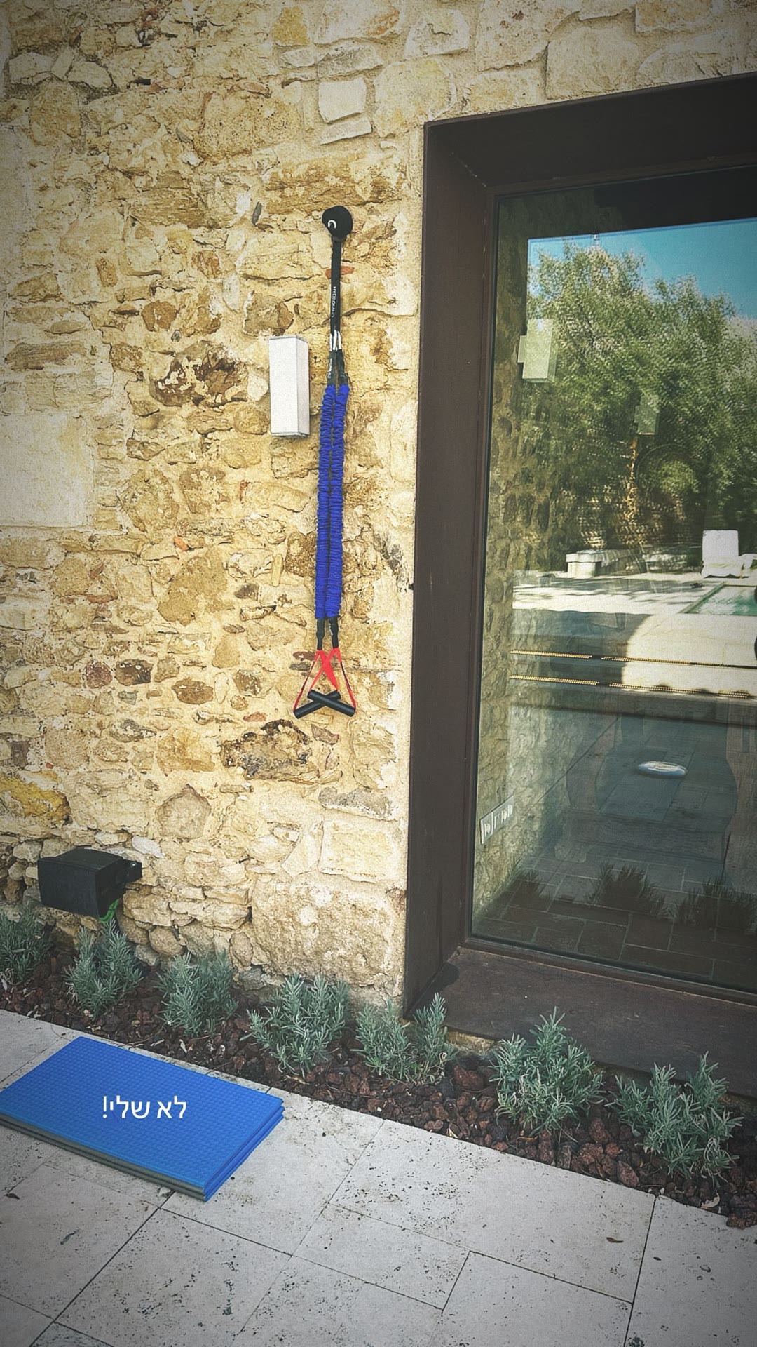 Resistance band by the pool in Spain
