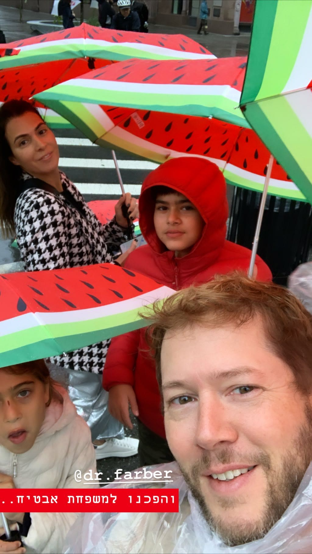 Rainy day in NYC under watermelon umbrellas