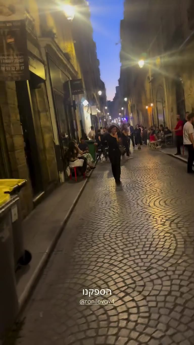 Evening walk on a cobbled Paris street