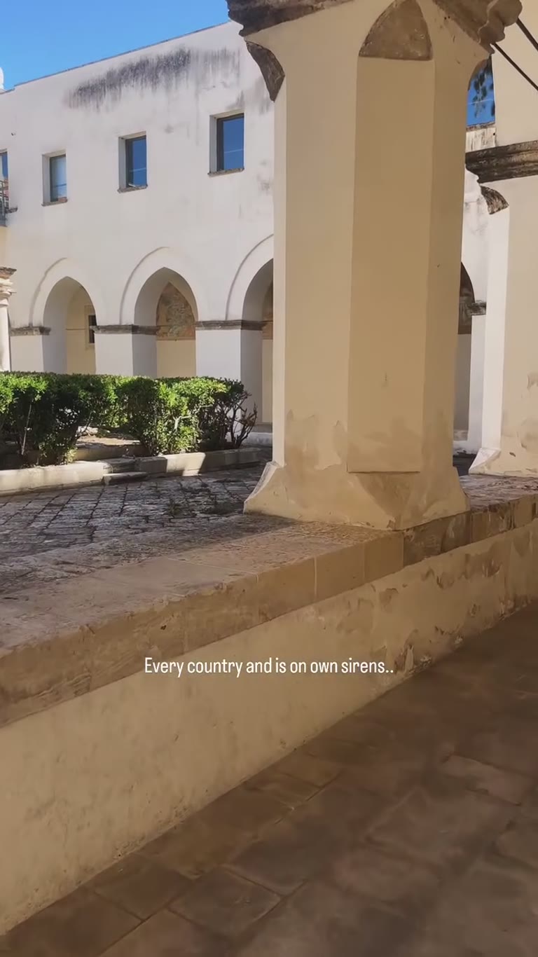 Sunlit cloister courtyard in Puglia