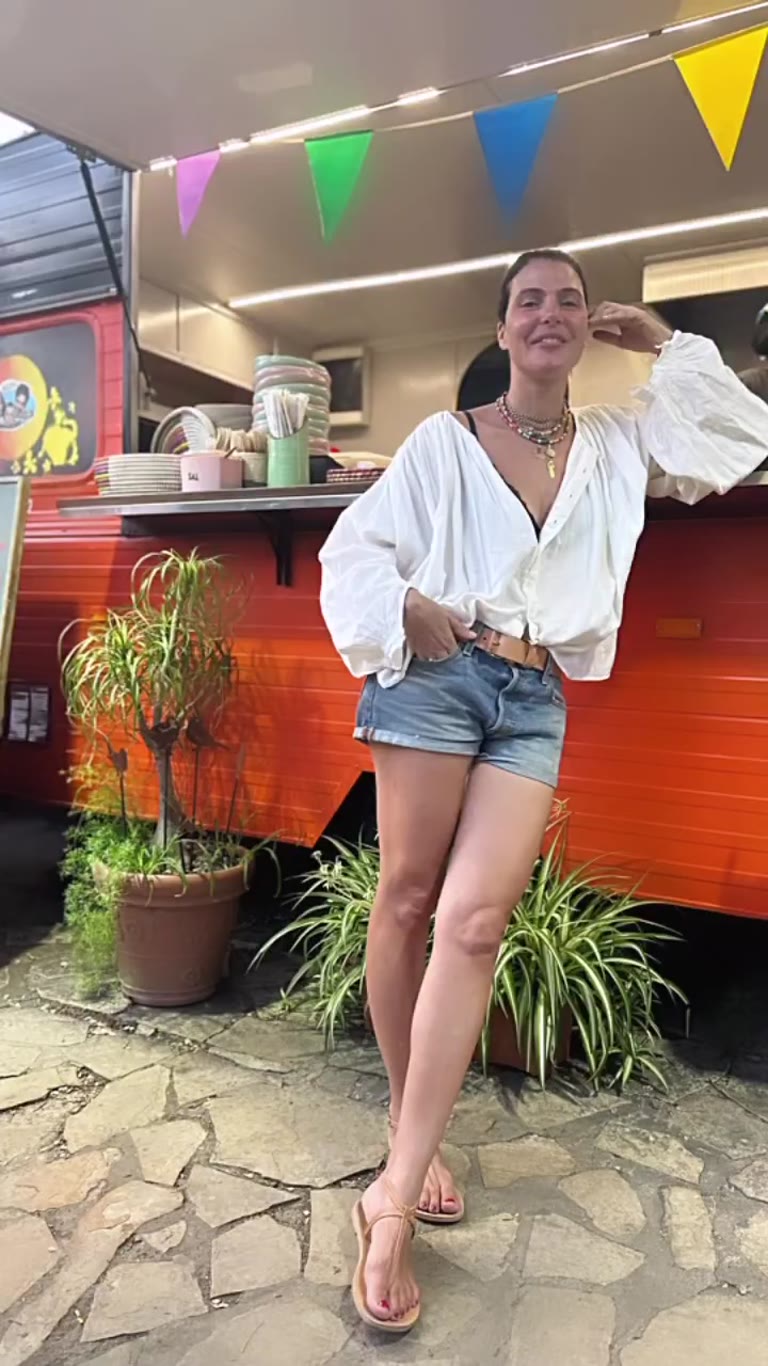 Outfit pose at a colorful Spain food truck