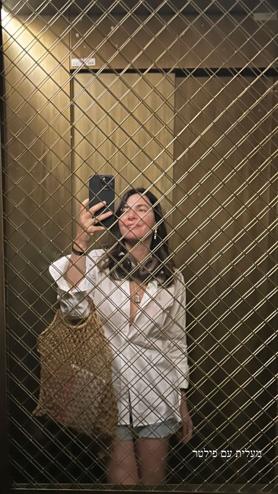 Elevator mirror selfie in Madrid