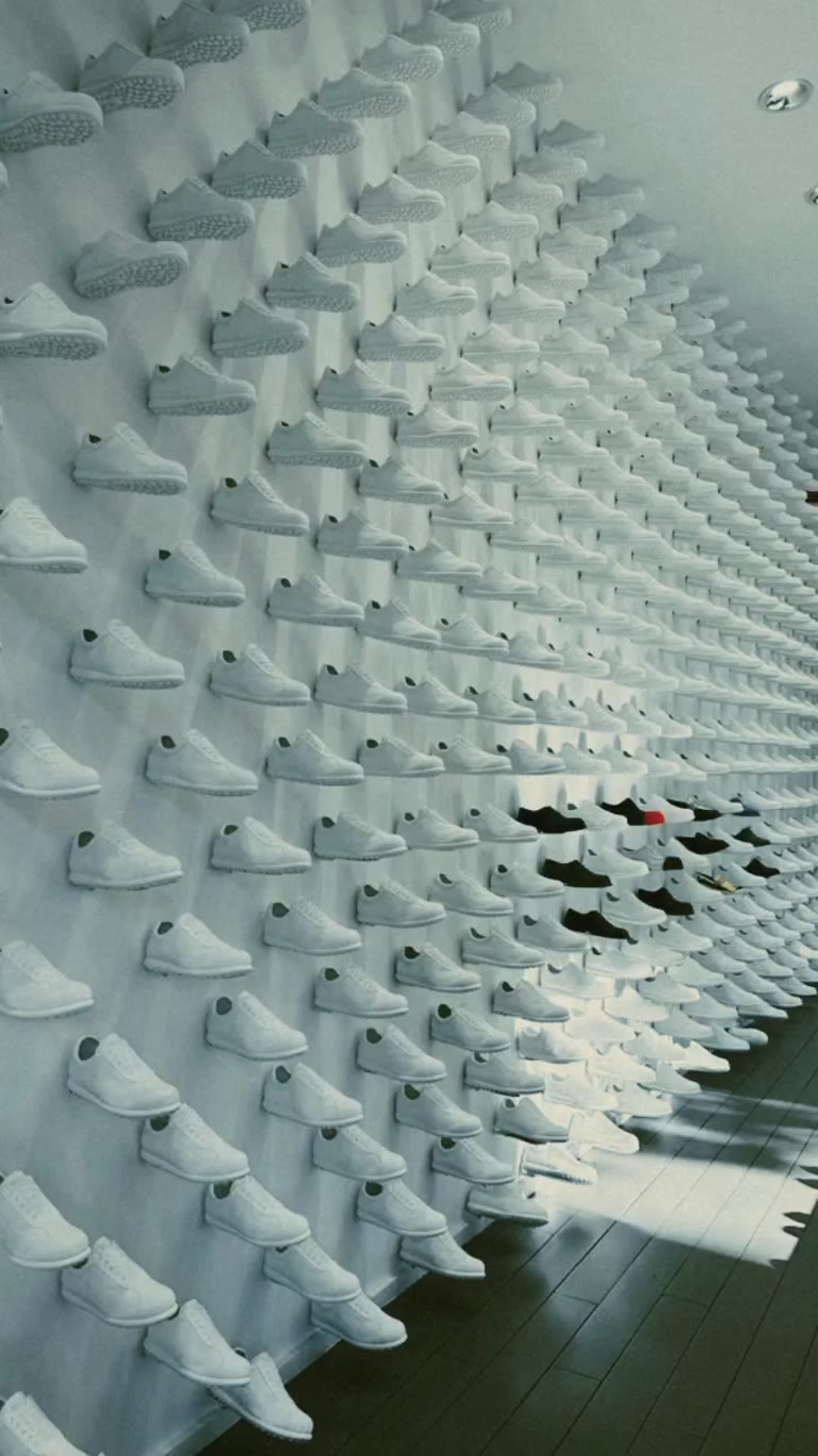 Wall of white sneakers at a Madrid sneaker store