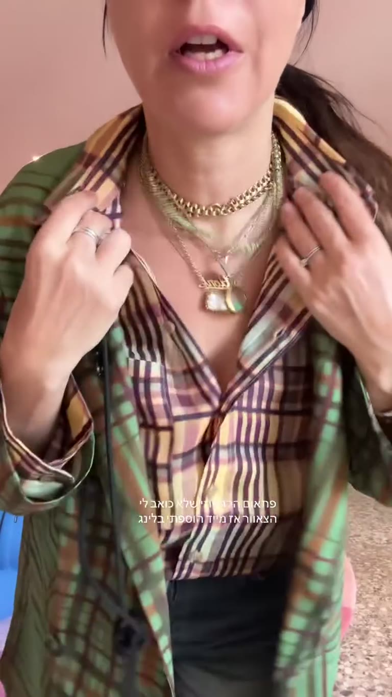 Green plaid layered outfit in a Venice hotel room