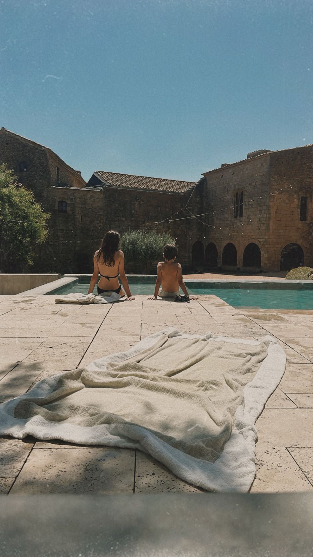 Poolside at a stone masia in Spain