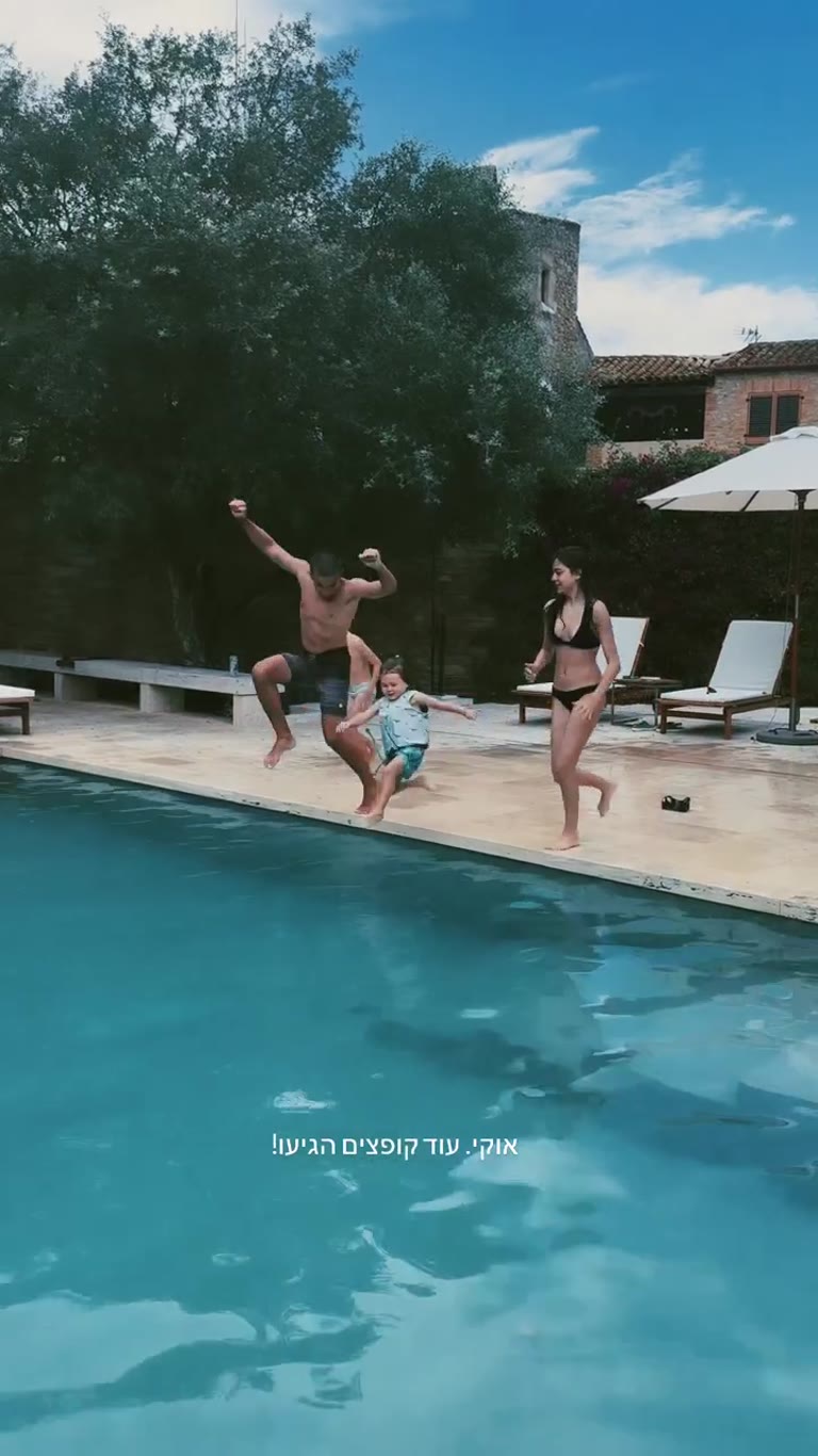 Family pool jump at a Spanish villa