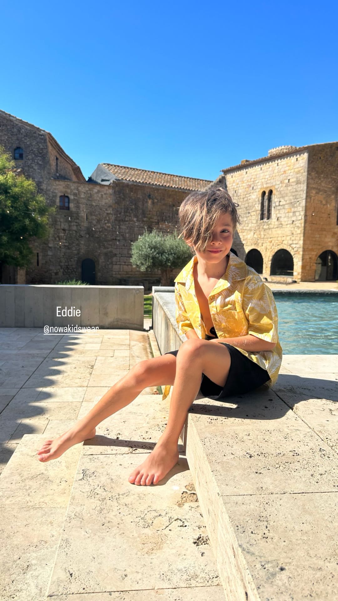 Eddie by the pool at a stone villa in Spain