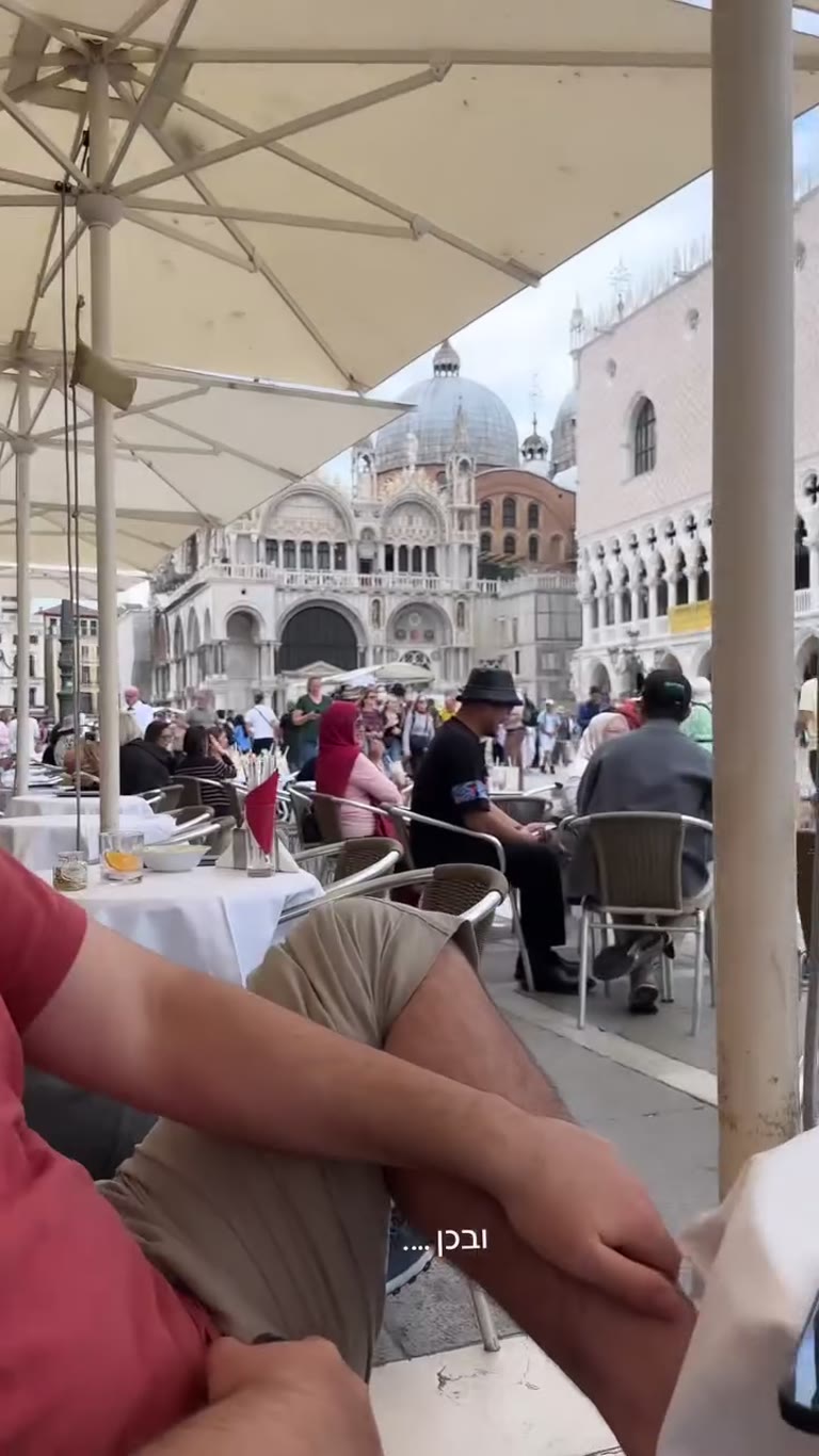 Joking over drinks on Piazza San Marco, Venice