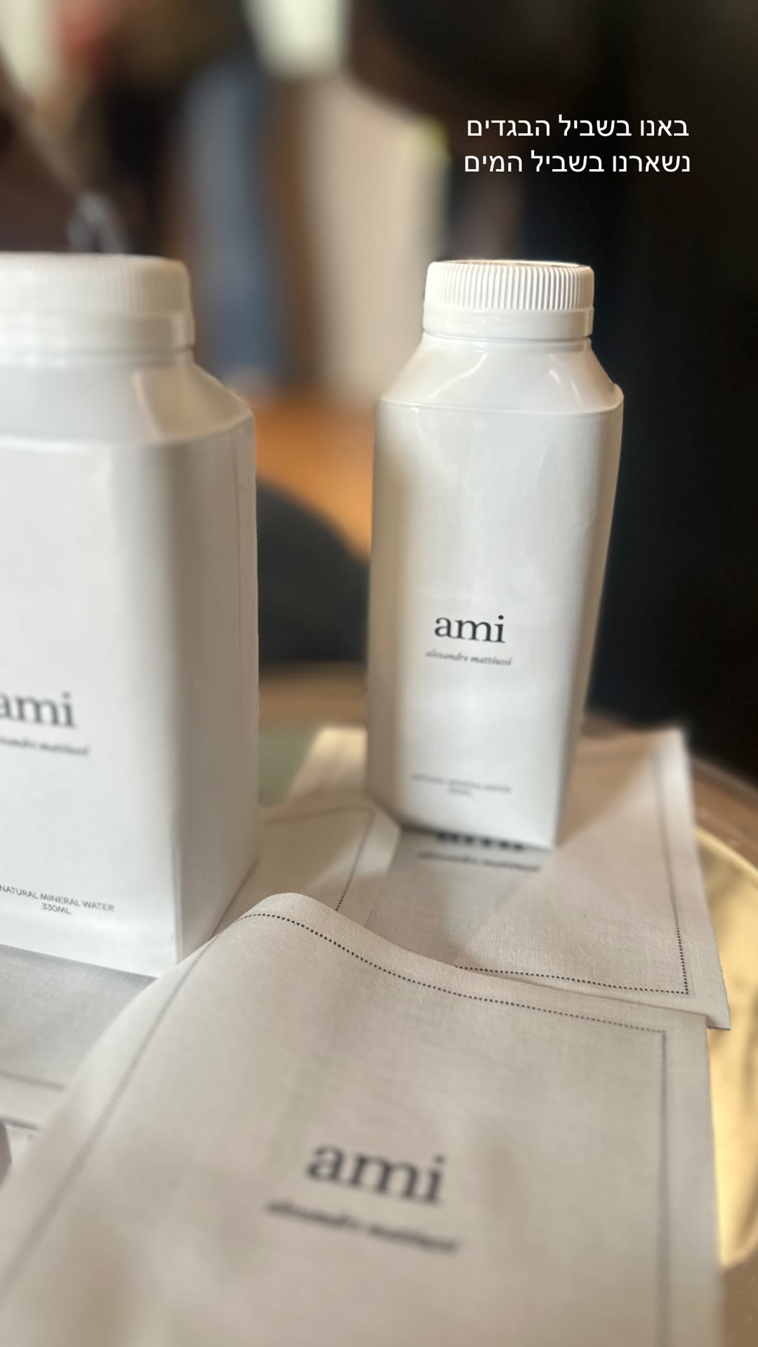Ami Paris store — branded water