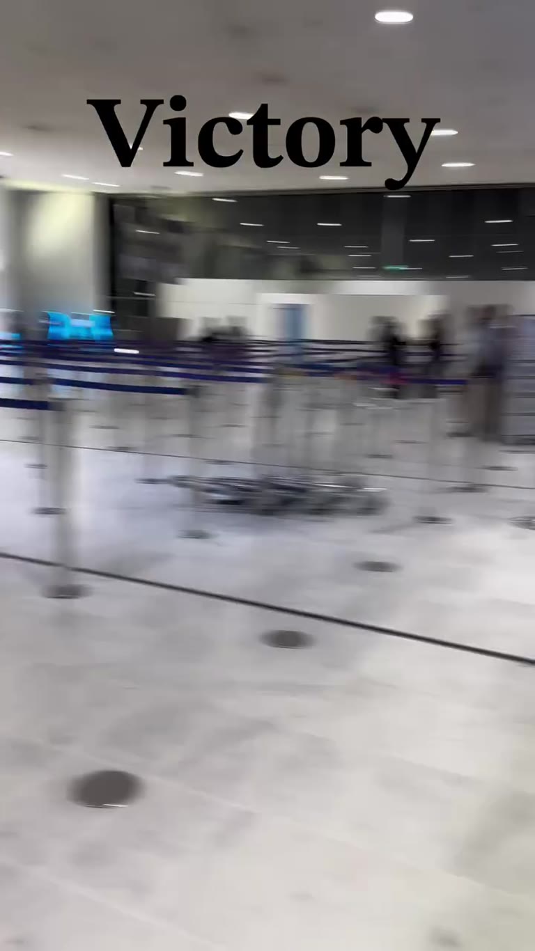 "Victory" moment at airport check-in