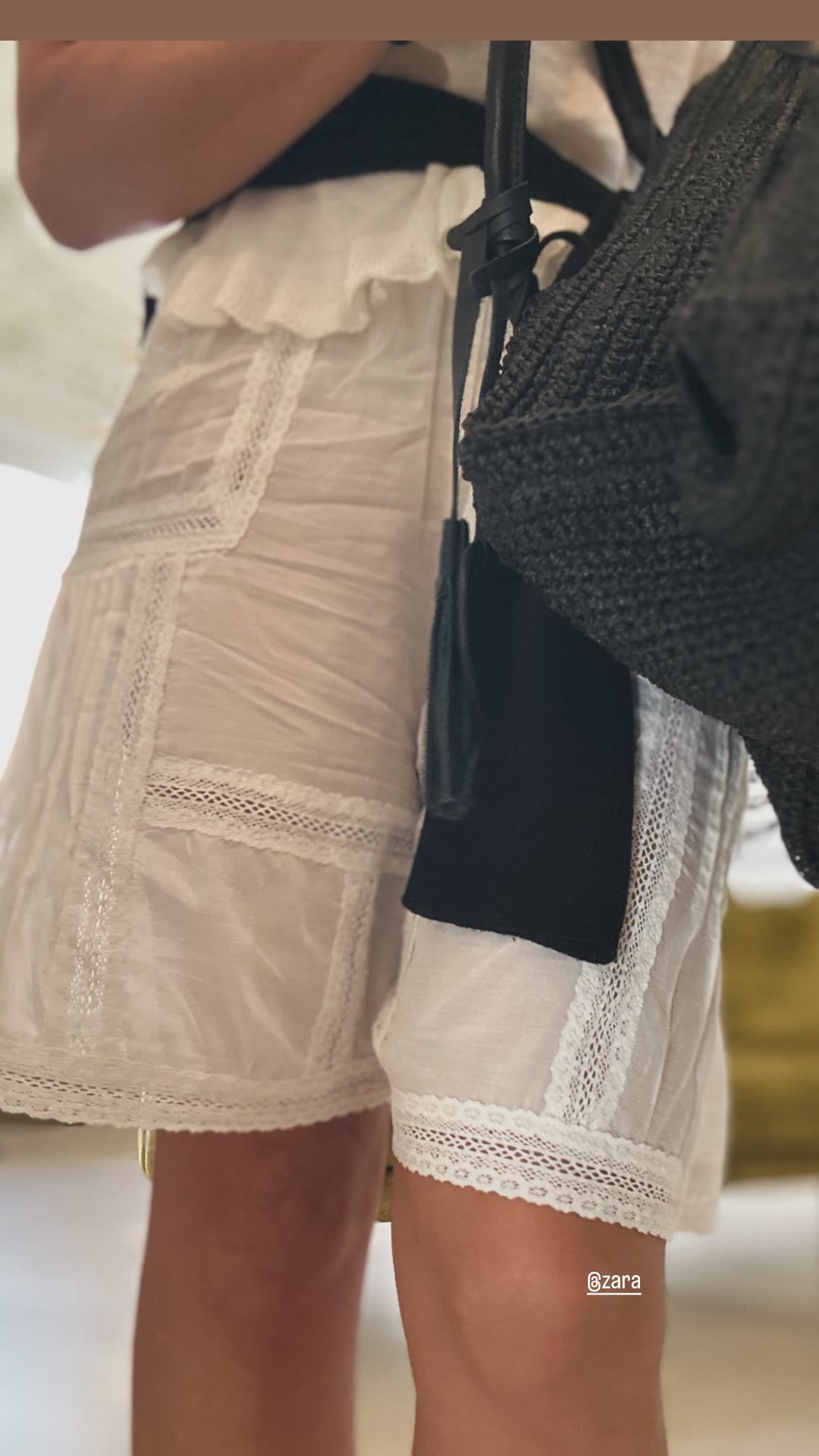 Zara lace shorts and crochet bag outfit detail