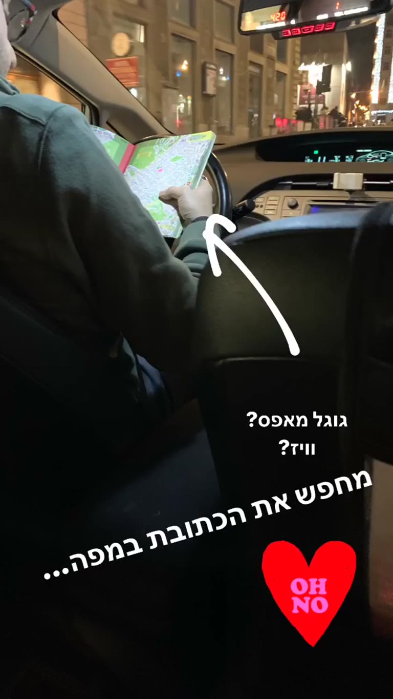 Rome taxi driver navigating with a paper map