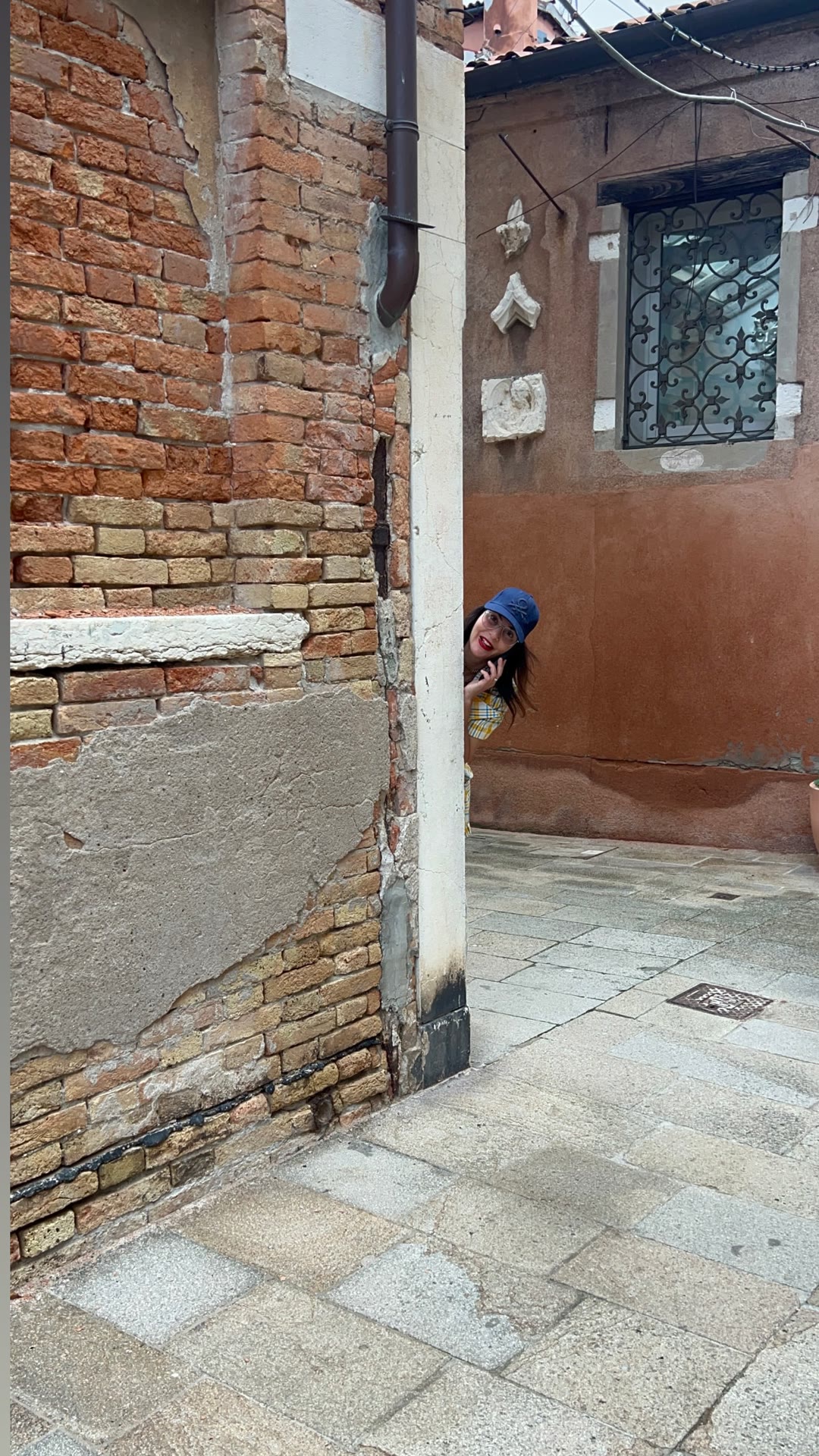 Peeking around a corner in Venice