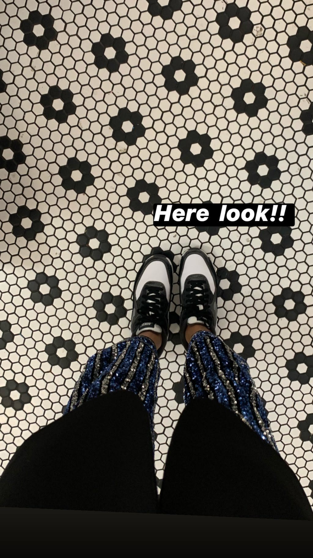 Sequin skirt and Nikes on tiled floor