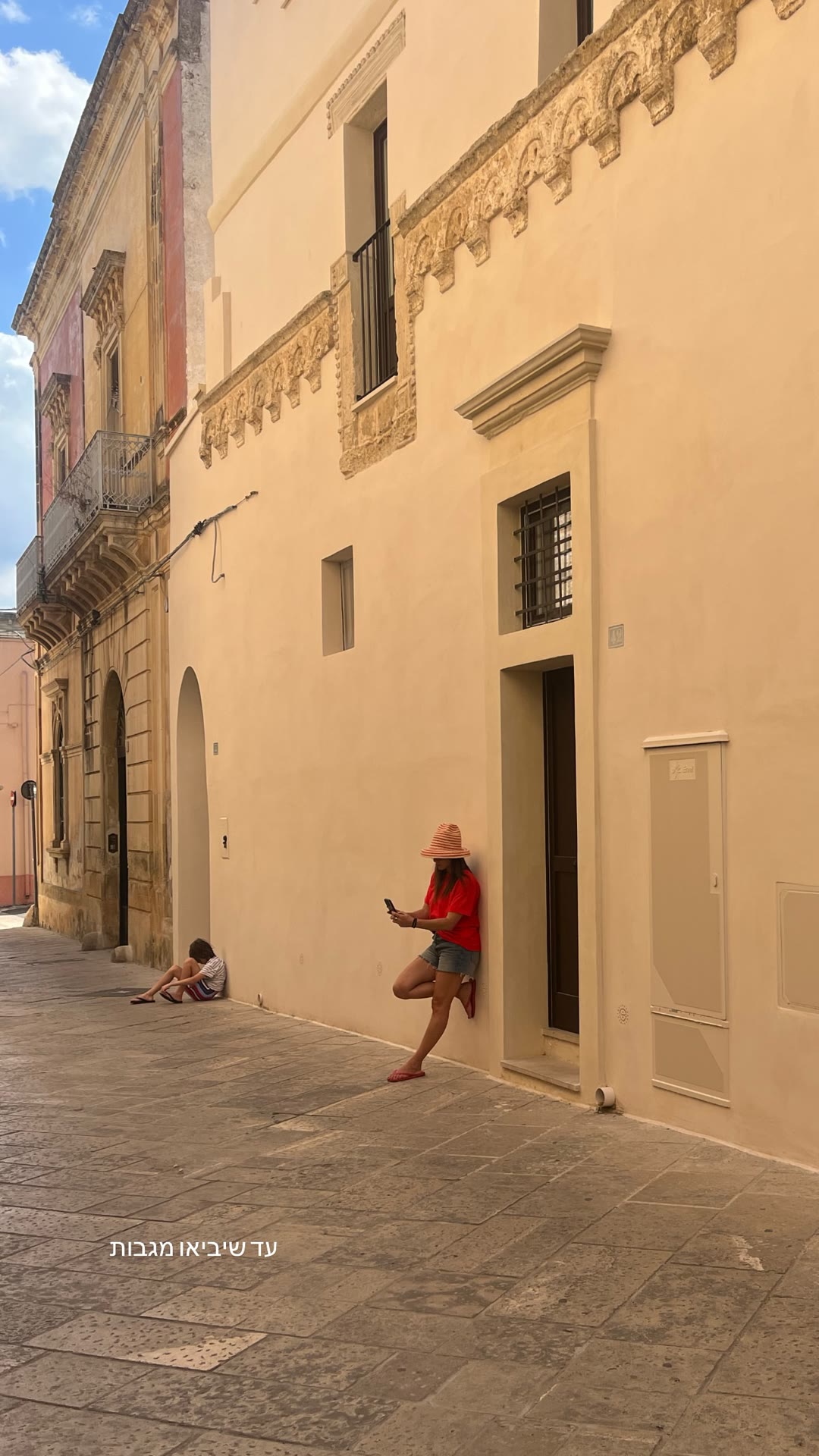 Waiting in a sunlit Puglia alley