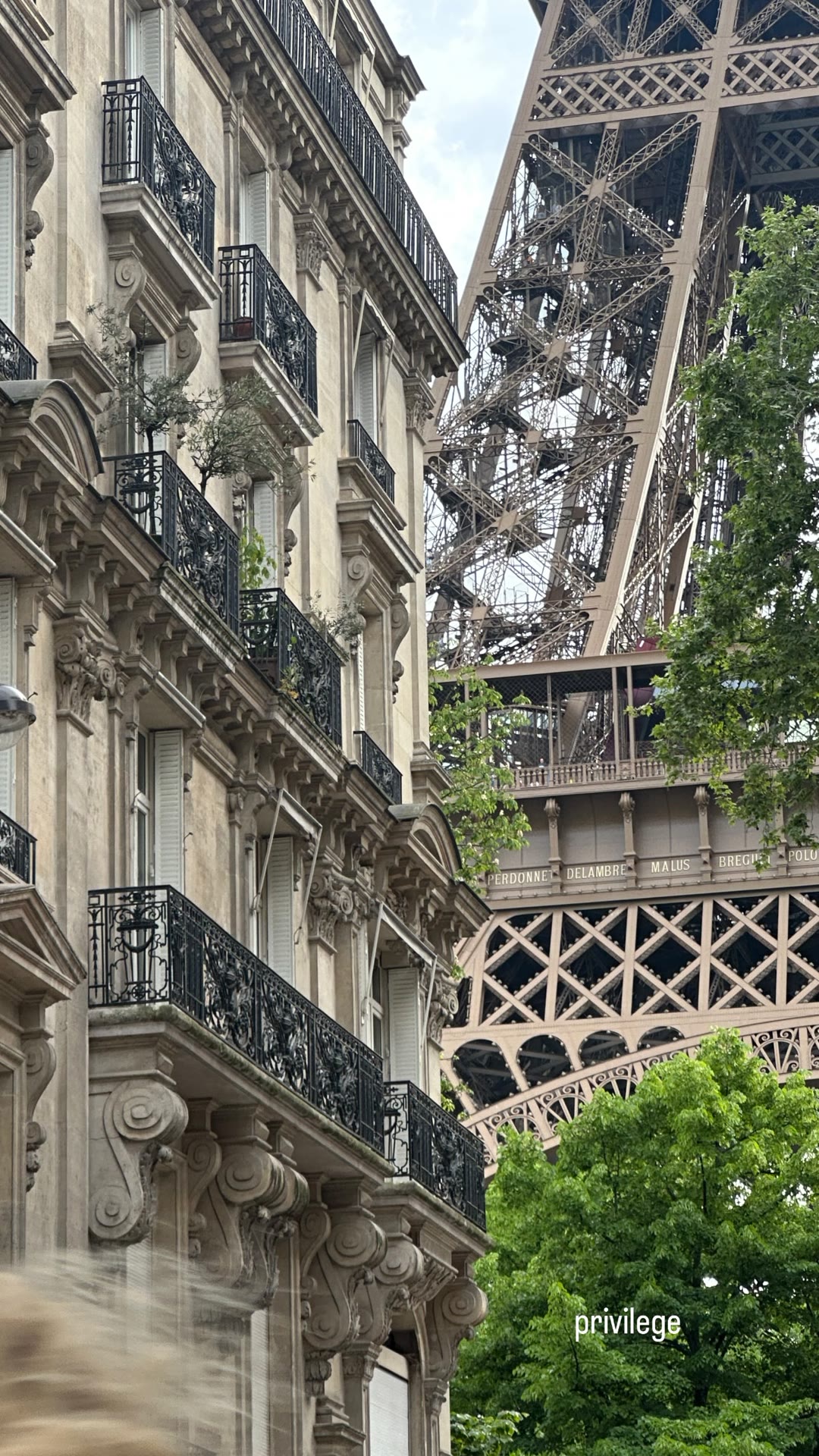 Eiffel Tower framed by Haussmann balconies