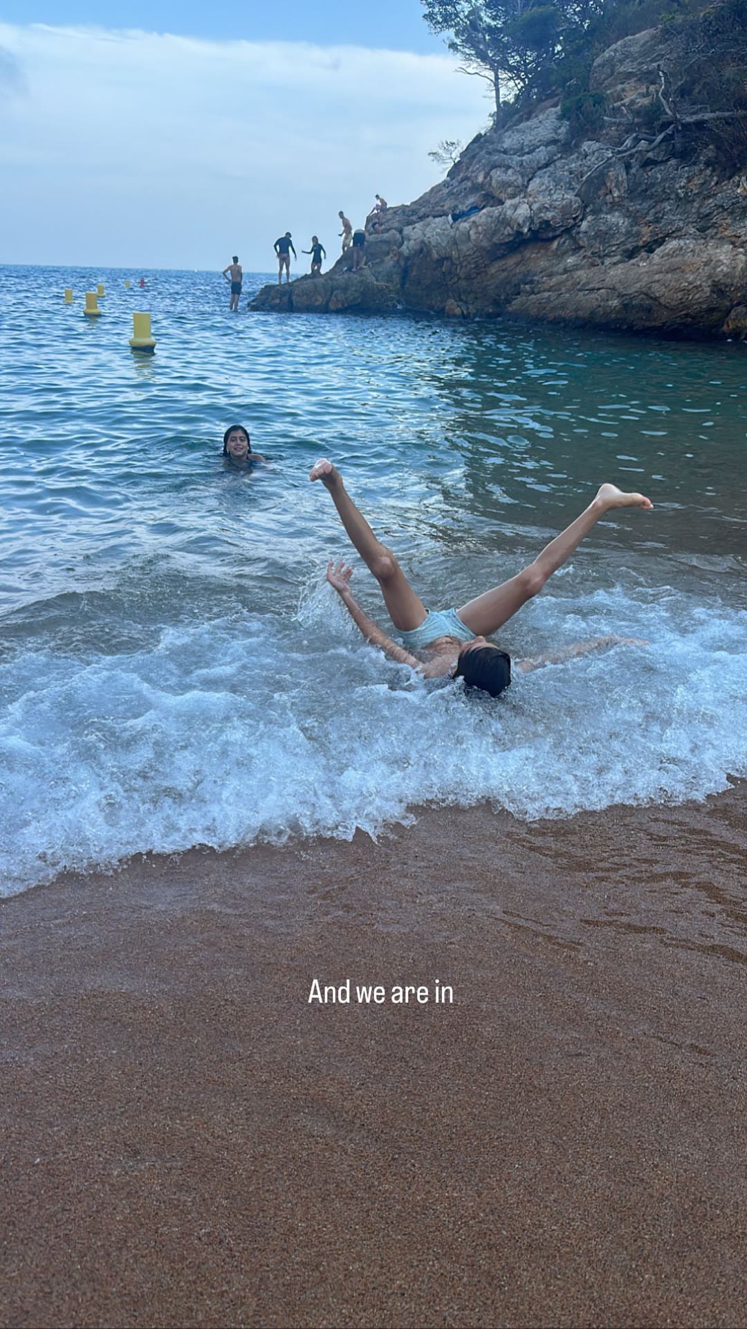 Splashing into a rocky cove in Spain