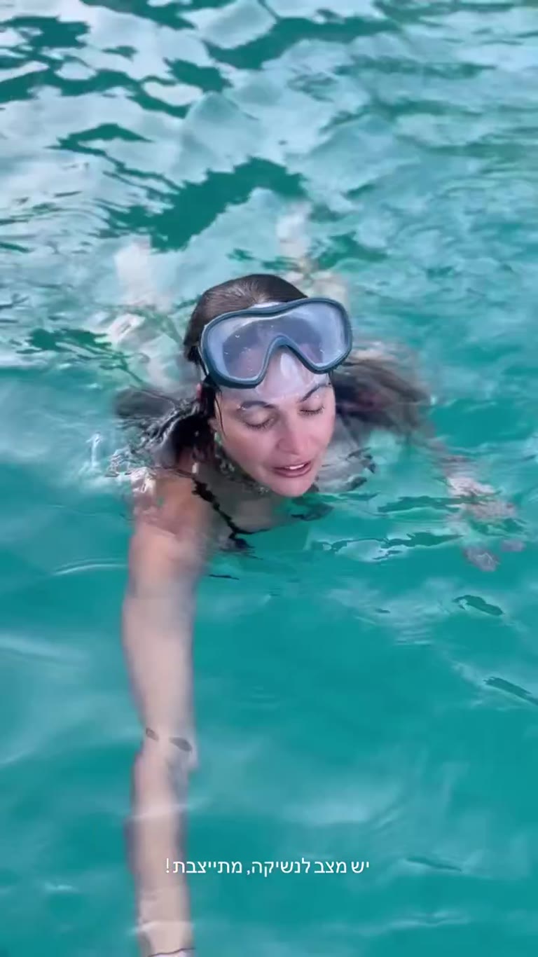 Swimming in turquoise water in Spain