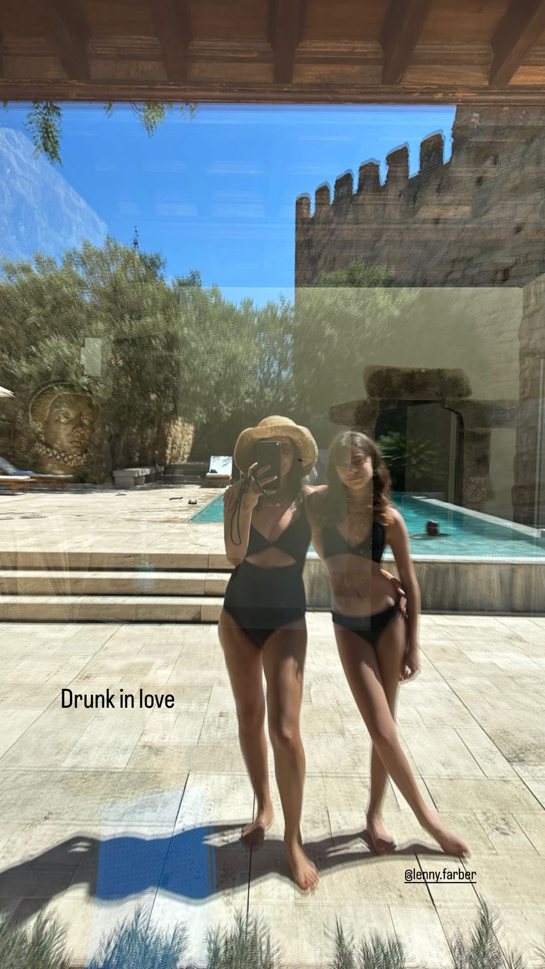 Poolside mirror selfie at a Spanish stone villa