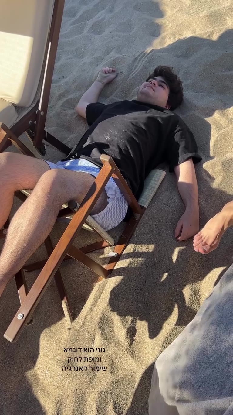 Friend passed out on the sand in Puglia