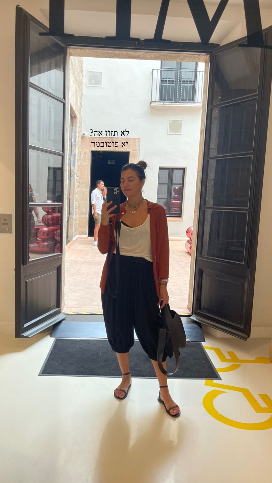 Mirror selfie in a Barcelona gallery doorway