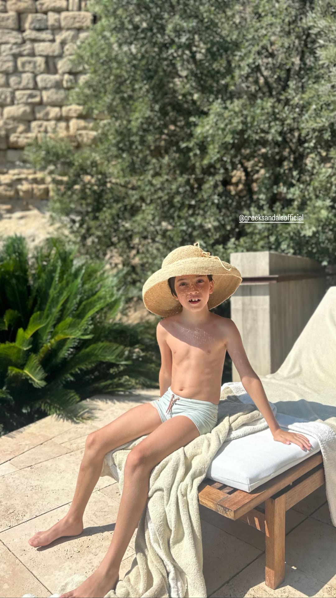 Poolside sun hat moment in Spain