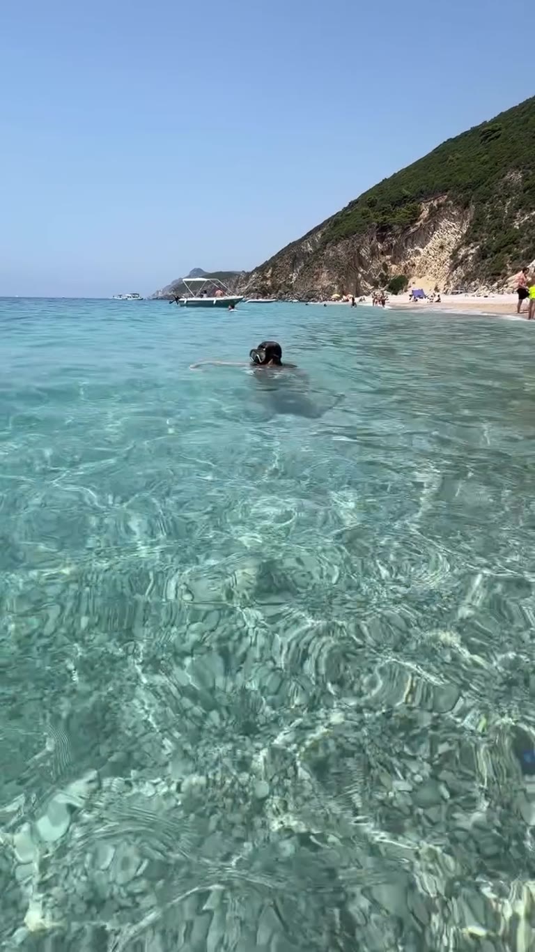 Swimming in Corfu's crystal-clear water