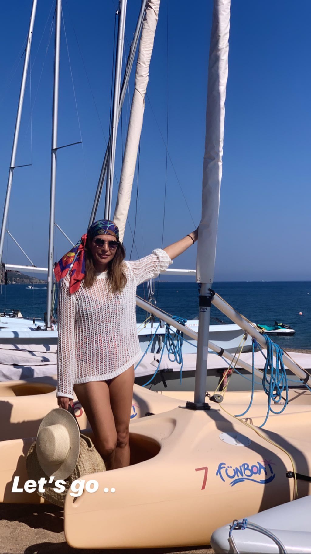 Catamarans and jet skis on a Cyprus beach