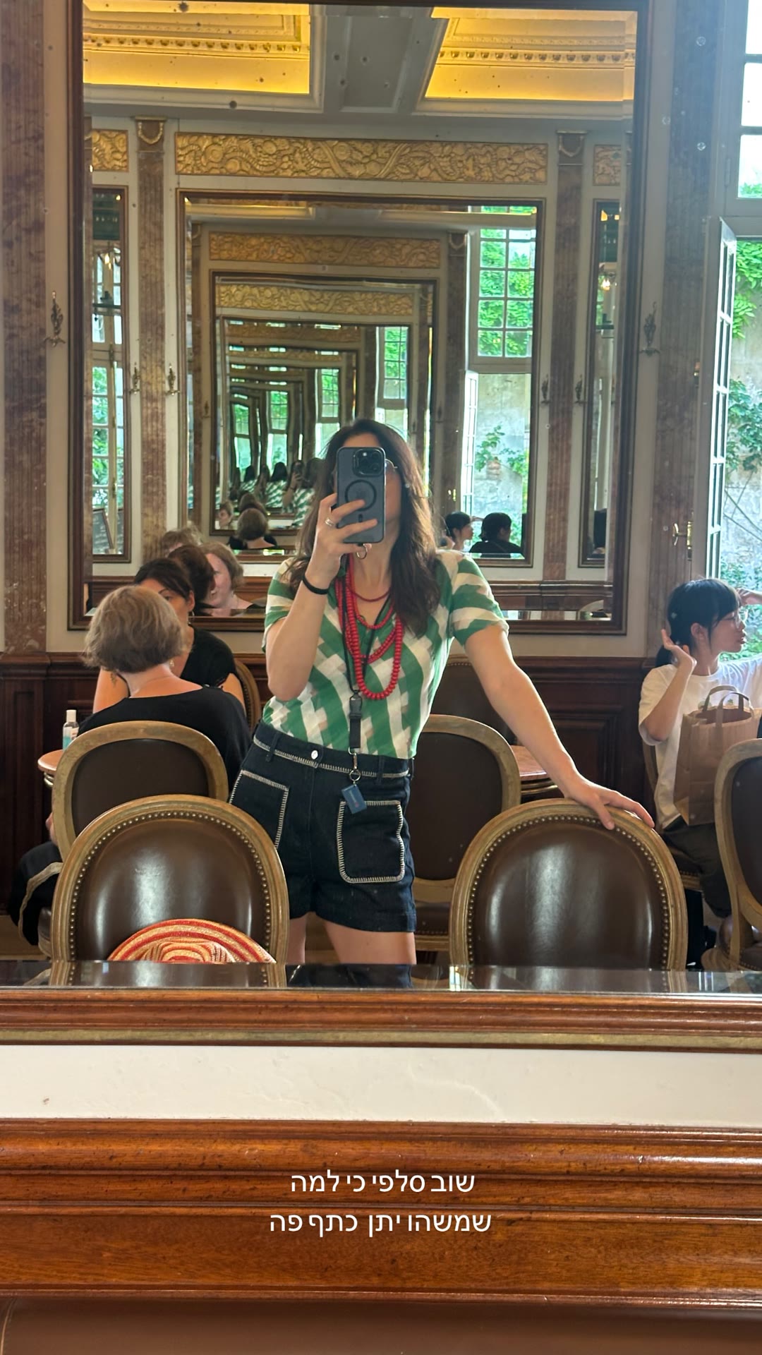Mirror selfie in a gilded Paris café