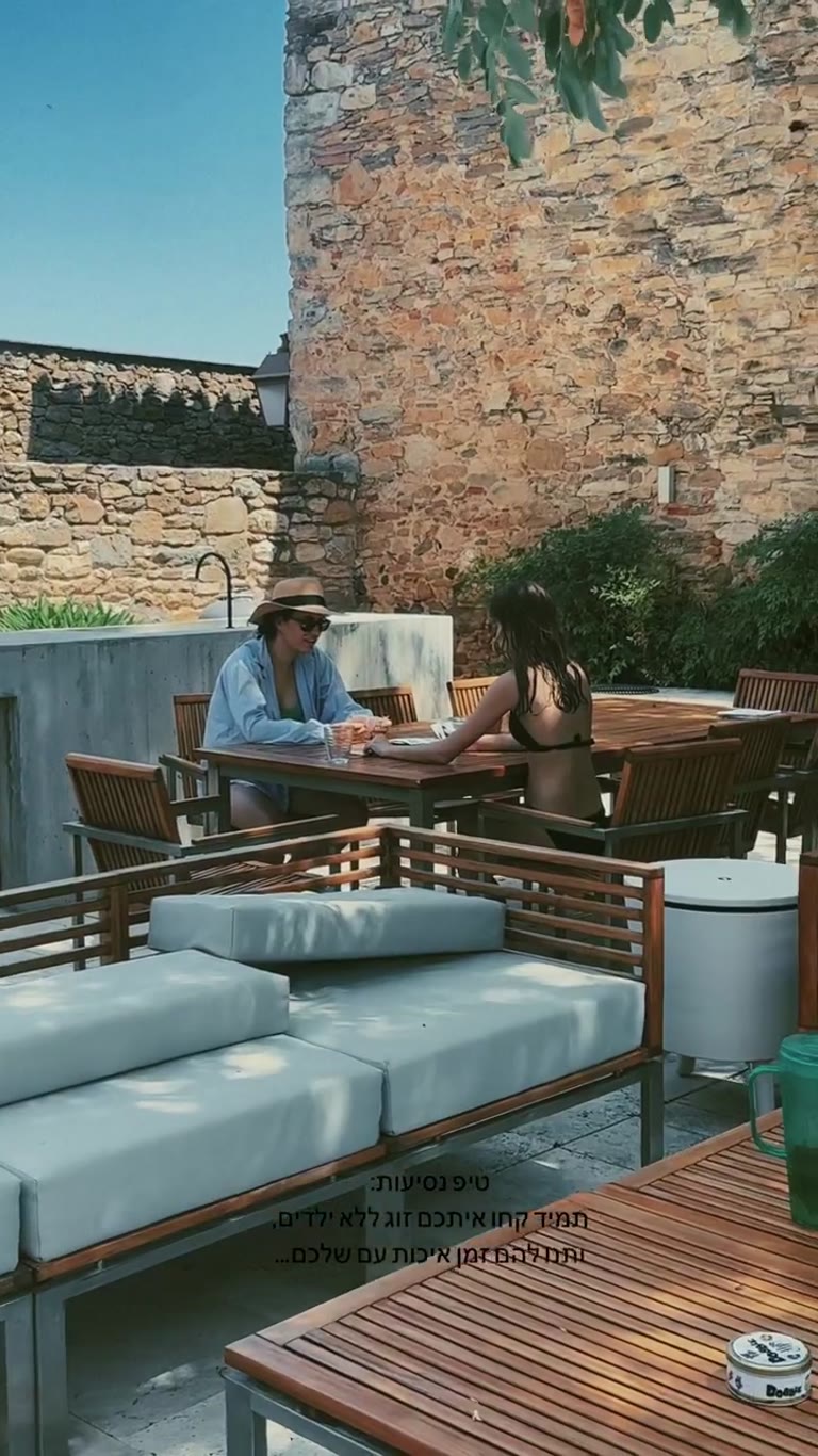 Stone-walled hotel pool in Spain + travel tip