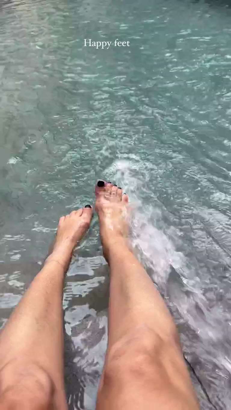Feet in the pool in Madrid