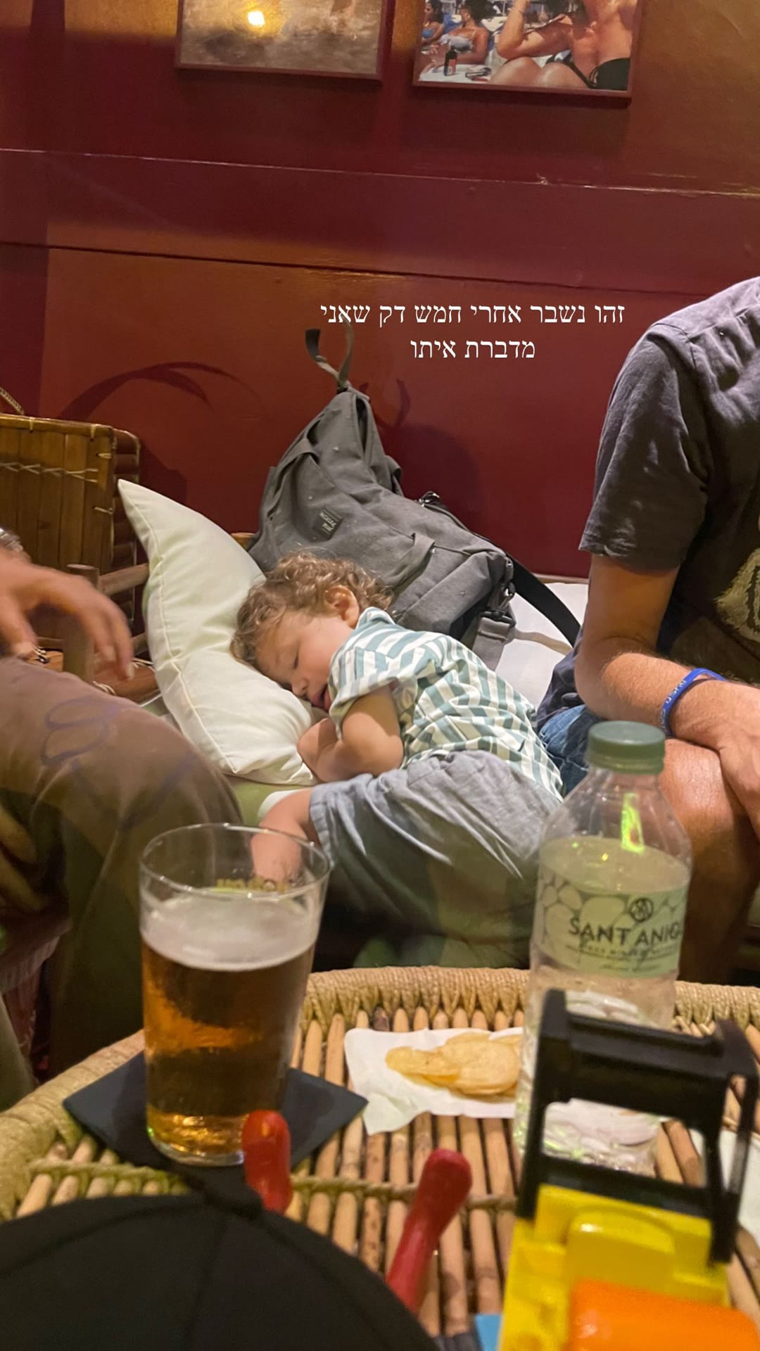 Toddler asleep at a Barcelona bar