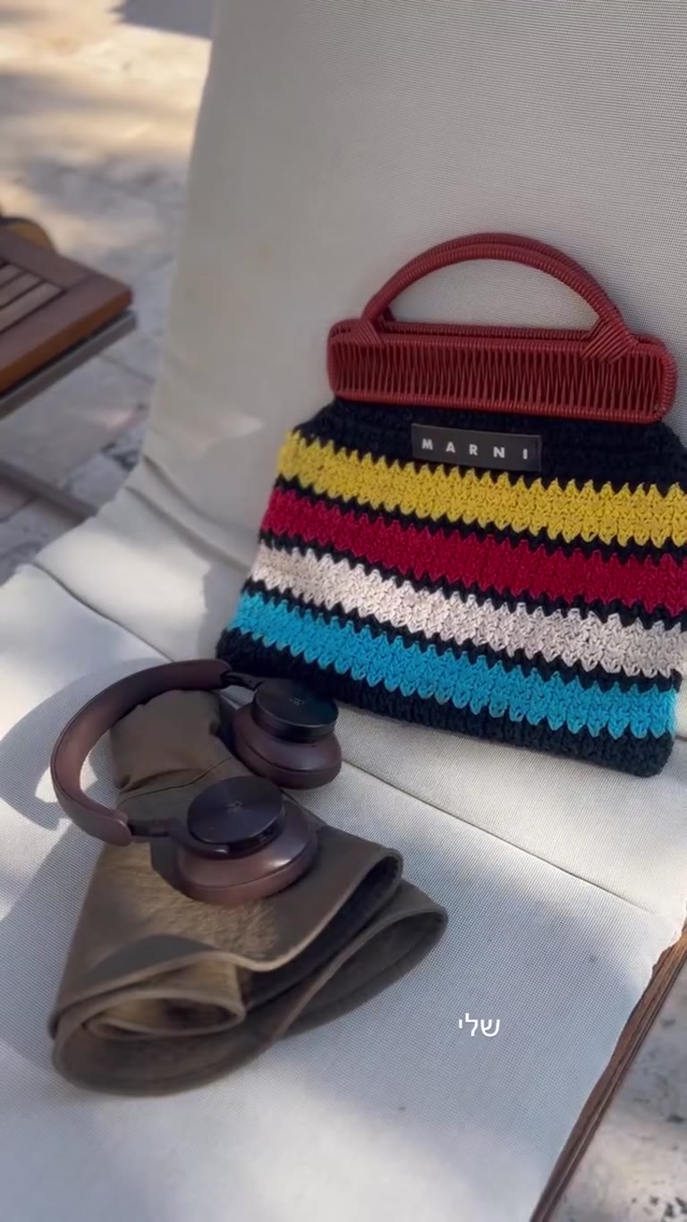 Poolside Marni bag and headphones in Spain