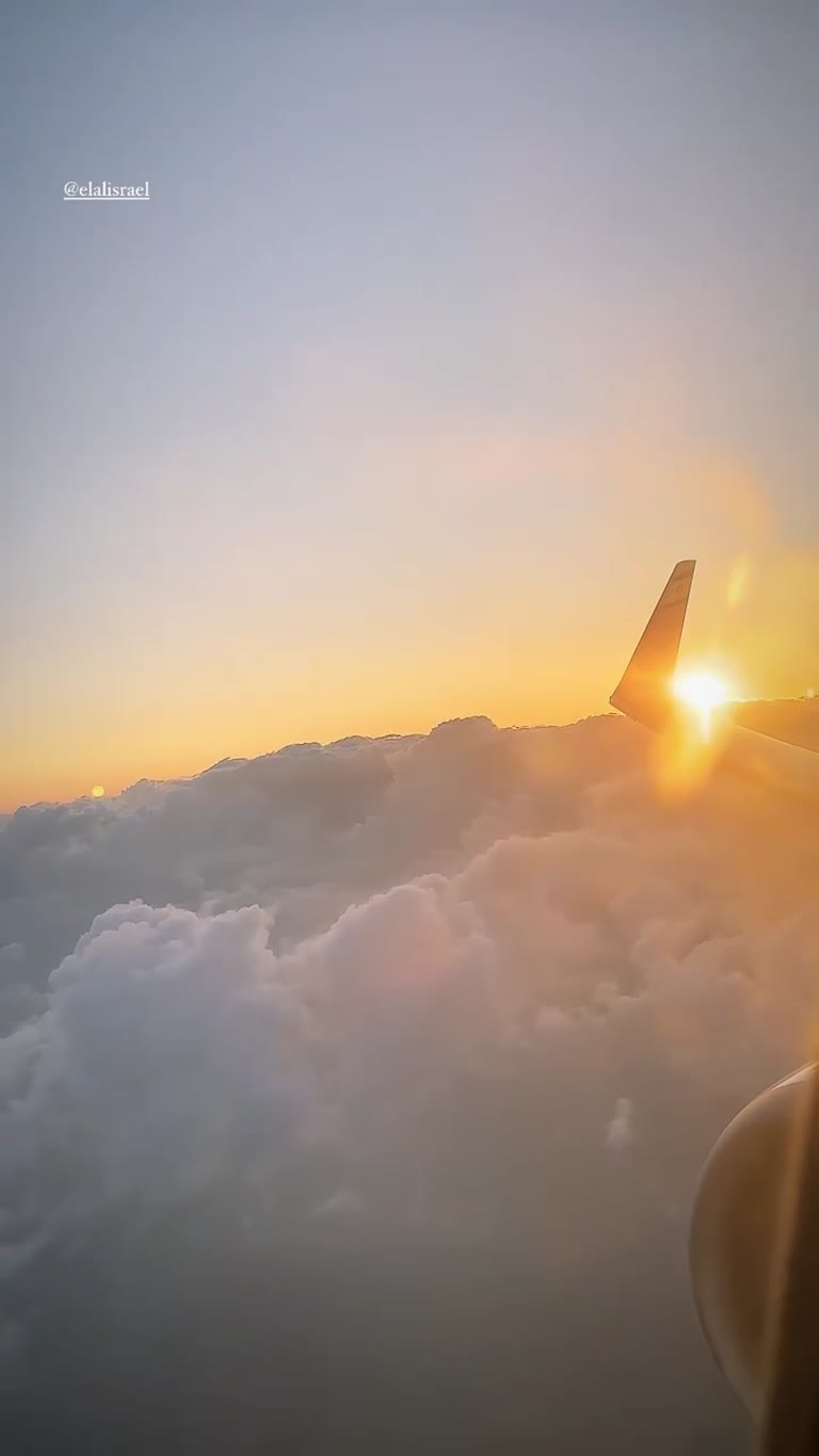 Sunset above the clouds on an El Al flight