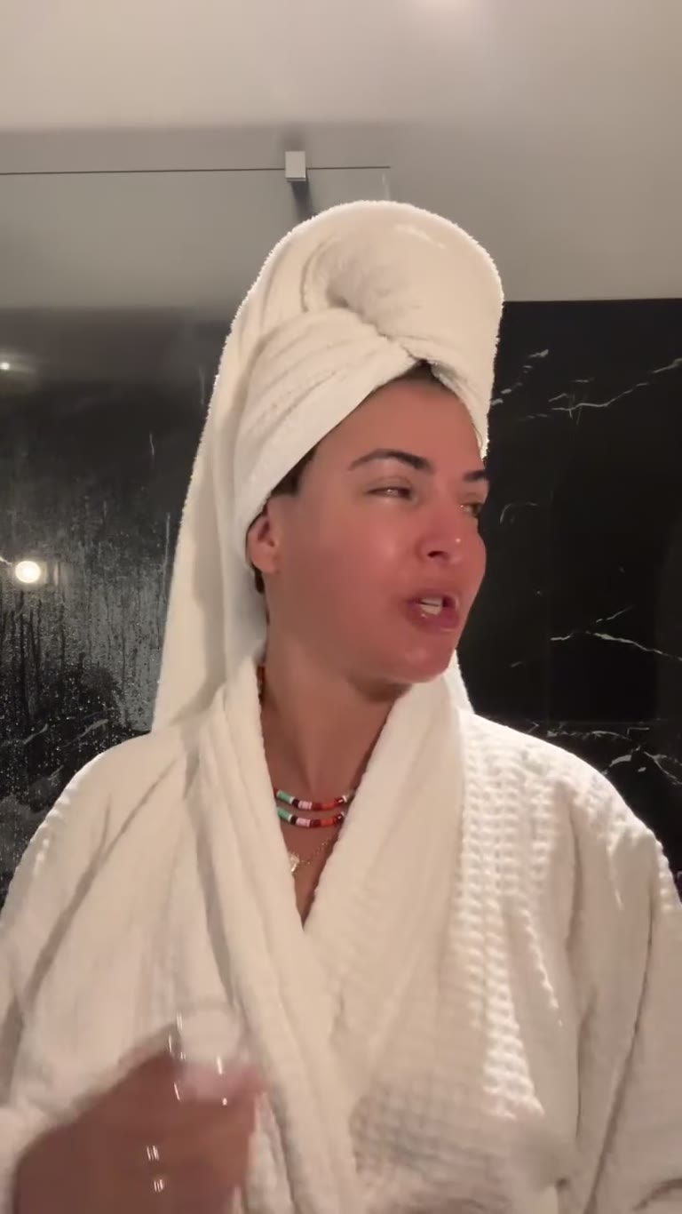 Morning skincare in the hotel bathroom